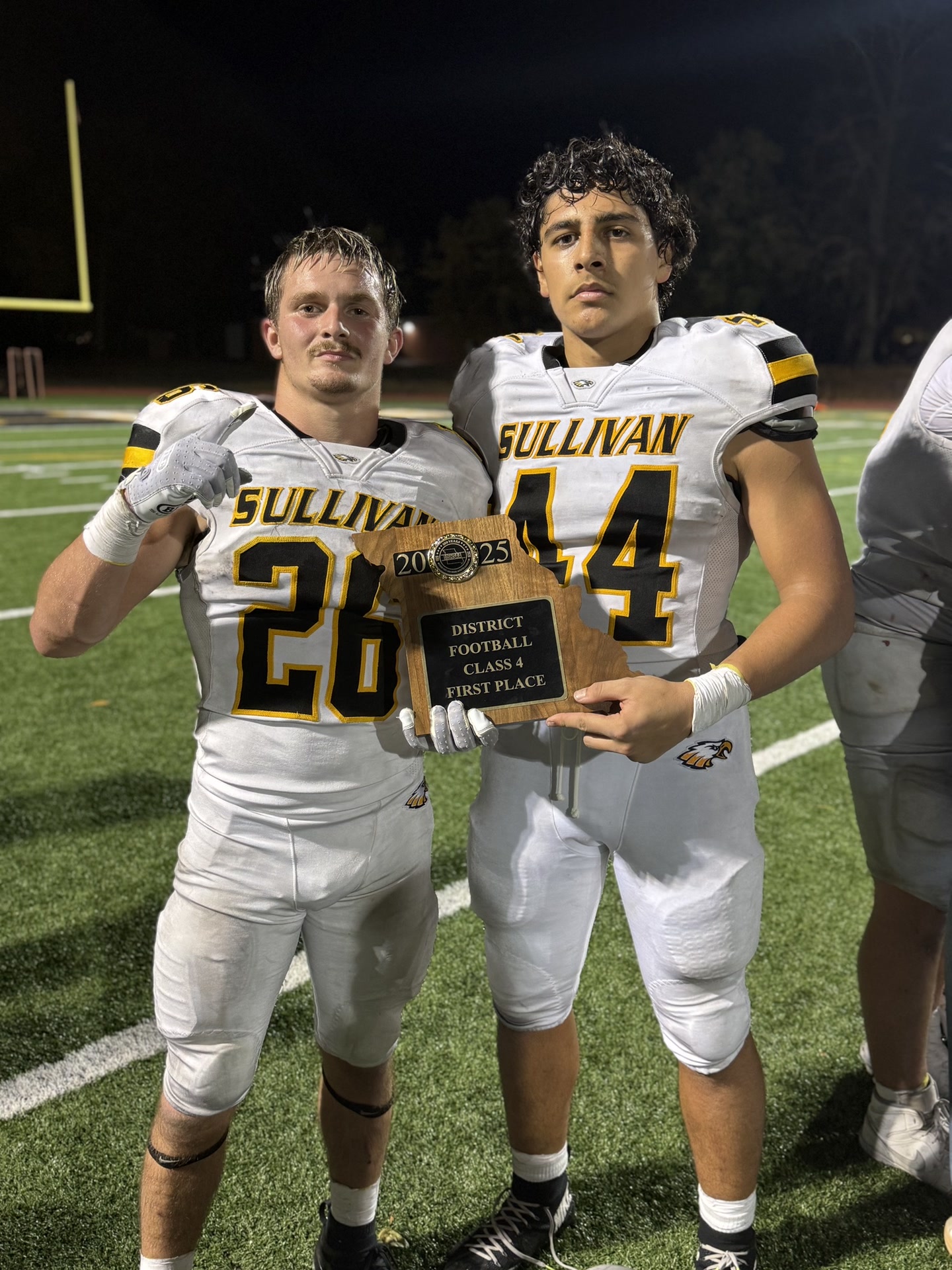 Nathan Garcia #44 holding District Football Class 4 First Place trophy