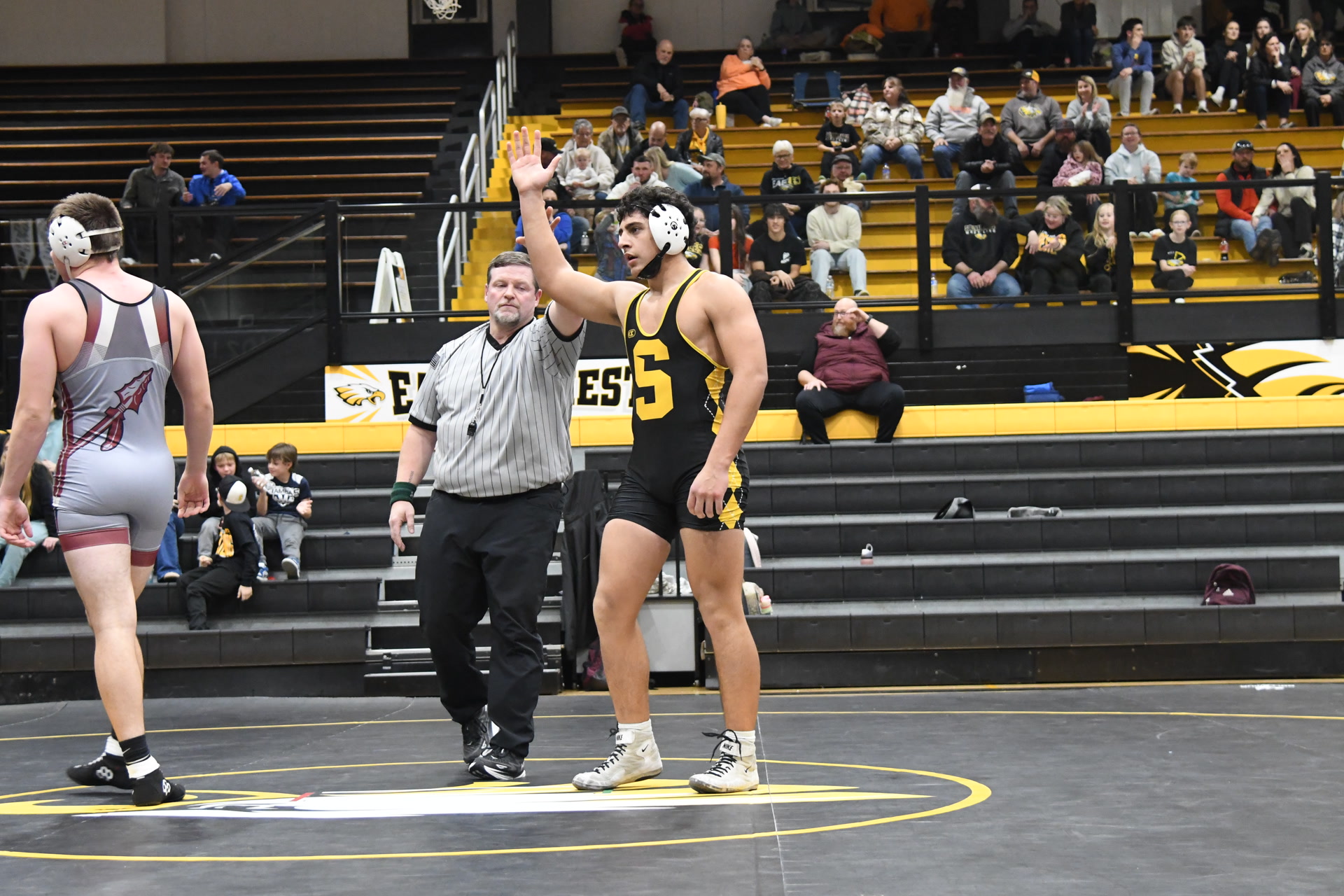 Nathan Garcia arm raised in wrestling victory